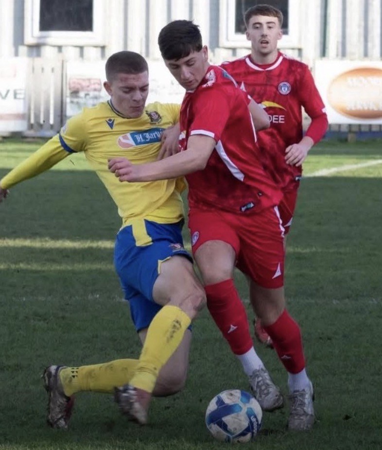 Joe Eason making a front-foot tackle in a senior match for Marske United