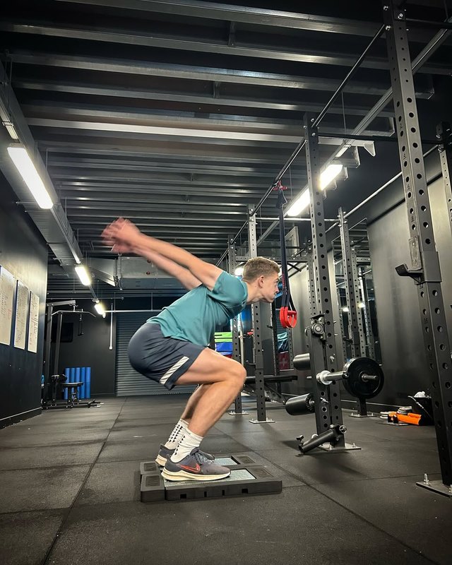 Joe in loaded squat phase before jump