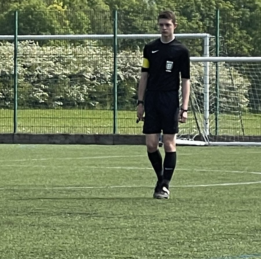 Joe Eason in referee kit on the pitch