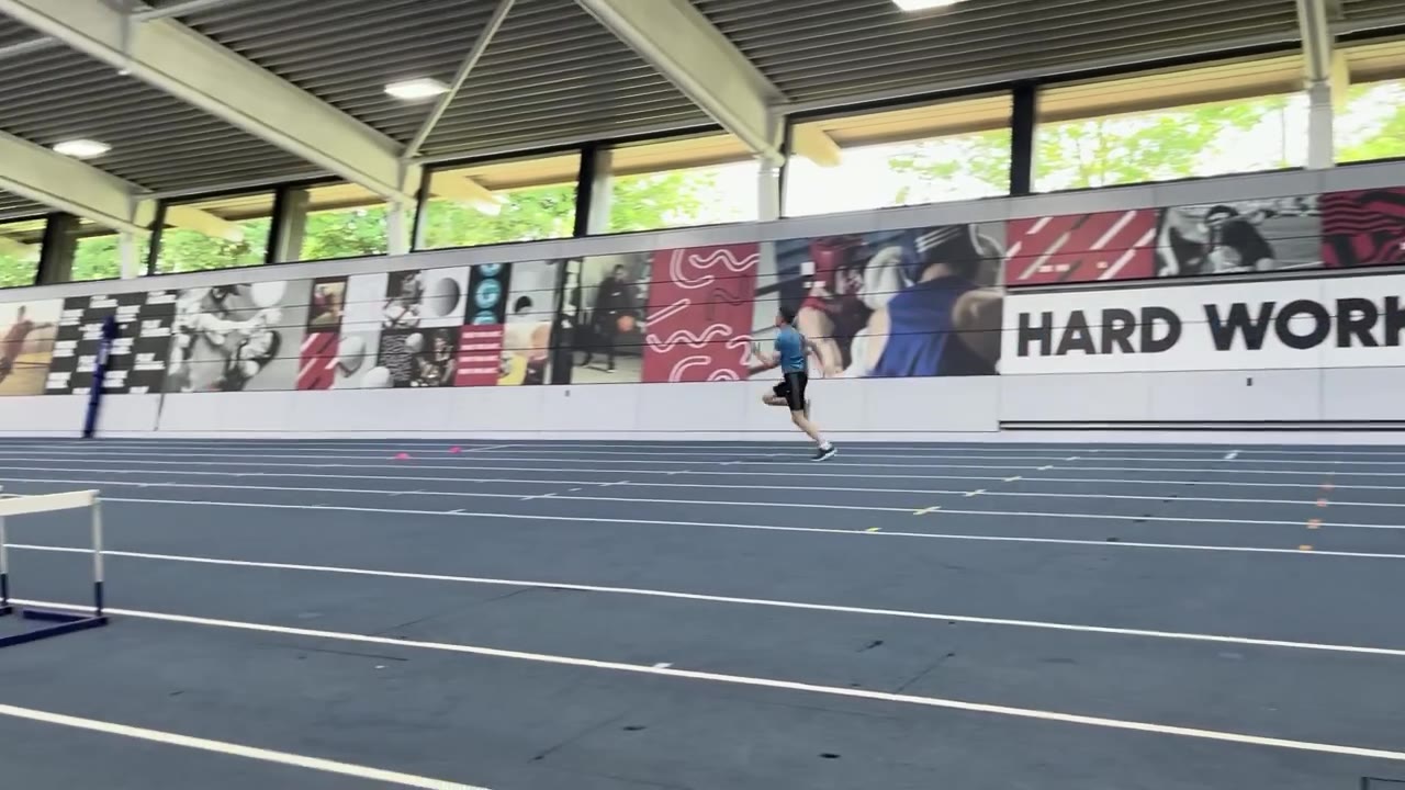 Joe Eason sprinting on an indoor track — session 2
