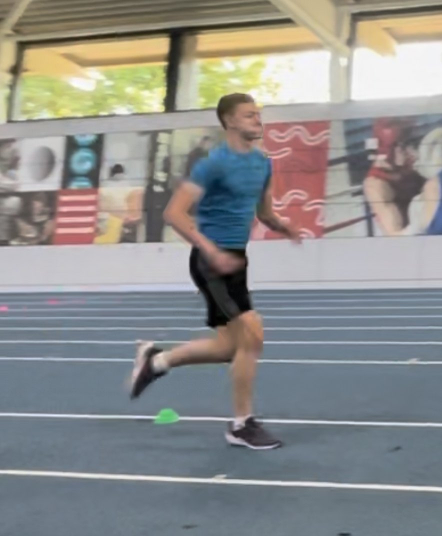 Joe Eason sprinting on an indoor track — session 1